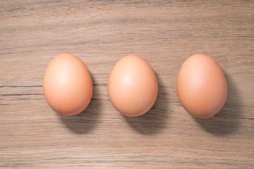 Set of Close up group three of Egg on wooden background, isolated, fresh egg