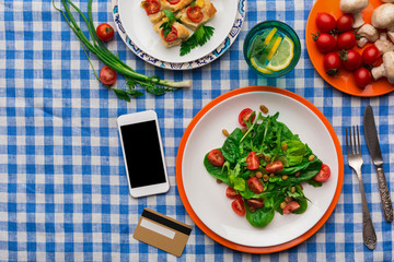 Healthy food shopping online with credit card, top view, copy space