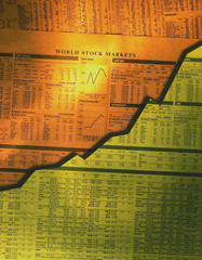 Close up of newspaper showing rising stock market share prices