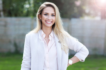 Obraz premium Outdoor close up portrait of young beautiful happy smiling woman