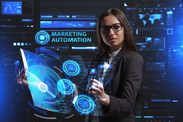 The concept of business, technology, the Internet and the network. A young entrepreneur working on a virtual screen of the future and sees the inscription: Marketing automation