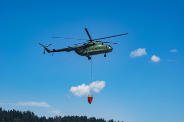 Fototapeta na wymiar Flying helicopter in the air