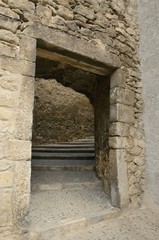Gate in stone alley in Girona, Spain