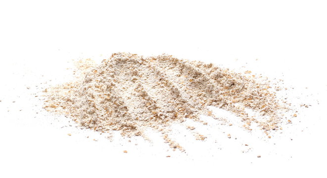 Pile of integral spelt wheat flour in wooden spoon isolated on white background