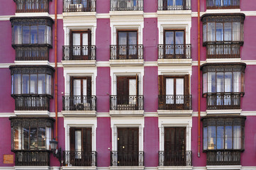 Frontal view of a building painted in purple.