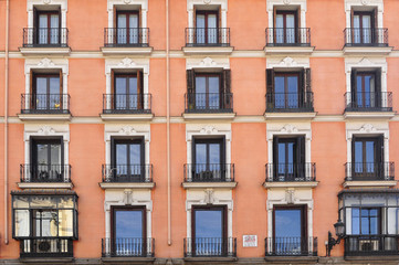 Frontal view of a building painted in orange