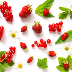 Fototapeta na wymiar Fruit berry pattern from a strawberry strawberry red currant leaves mint and lemon against a light background to copy space