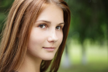 Close up portrait of young beautiful girl with long brown hair