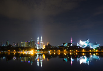 Fototapeta premium Kuala Lumpur skyline at night time as seen from Taman Tasik Titiwangsa also known as Titiwangsa Lake Garden located in Kuala Lumpur, Malaysia.