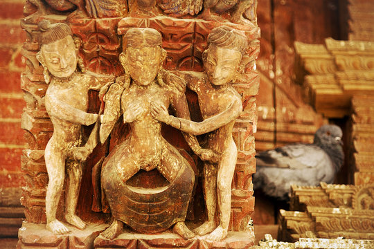 Erotic ancient kamasutra wooden carving under the roof of Jagannath Temple on Durbar square in Kathmandu, Nepal, Asia