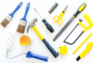 house renovation with implements set for building, painting and repair white table background top view