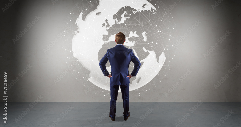 Poster Businessman using digital planet earth interface on a wall 3D rendering