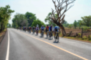 Fototapeta na wymiar Blur active road bicycle racer on outdoor training