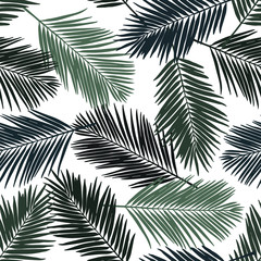 Seamless floral pattern with stylized palm leaves. Jungle foliage, green hues on white background. Textile design.