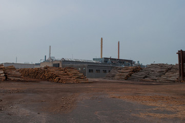 Industrial buildings and tree logs in Koege harbor