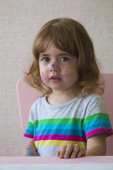 Fototapeta premium Portrait of a little girl with a painted face