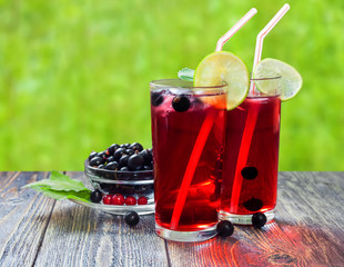 Cocktail with black currant juice and lime