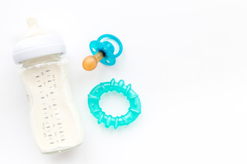 Mother care breast milk in bottle and infant formula powdered healthy food for baby feeding on white background top view space for text