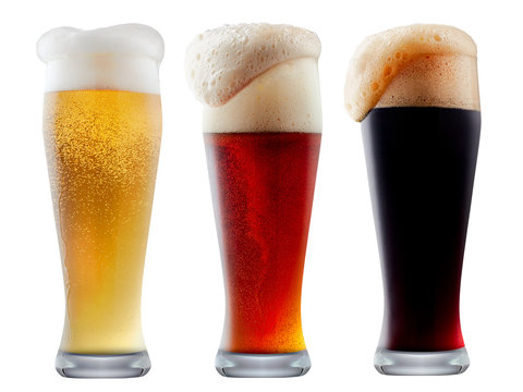 Mug collection of frosty dark red and light beer with foam isolated on a white background