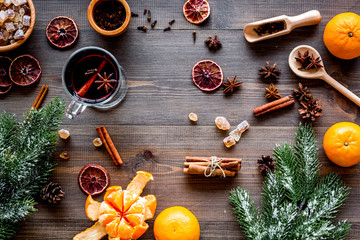 Merry christmas in winter evening with warm drink. Hot mulled wine or grog with fruits and spices...