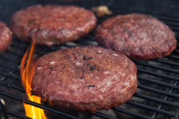 Beef or pork meat barbecue burgers for hamburger prepared grilled on flame grill