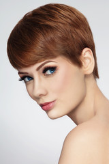 Young beautiful woman with stylish short haircut and fresh make-up, copy space