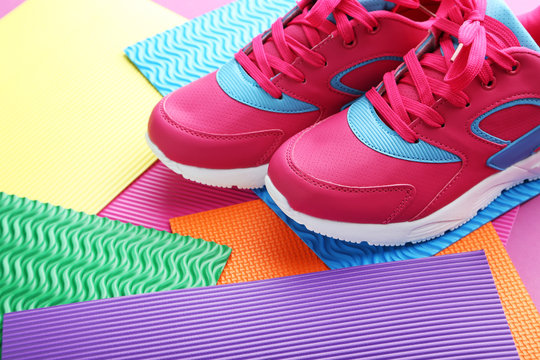 Sport shoes on colorful paper background