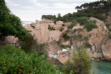 Beautiful panorama view of the sea an of the old fortificated city at Tossa-de-mar, Spain. Es colodar beach.