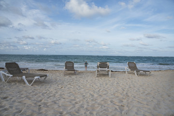 Fototapeta na wymiar Caribbean beach with turquoise water and dark clouds