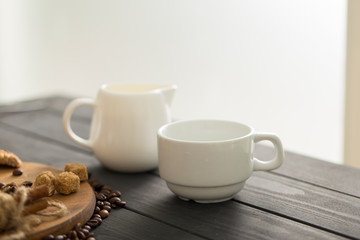 hot black coffee with cookies and beans in cafe