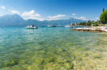 Fototapeta na wymiar view on crystal clear water in Lake Garda, Italy
