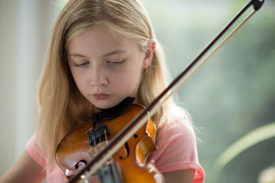 Close-up of a girl playing violin