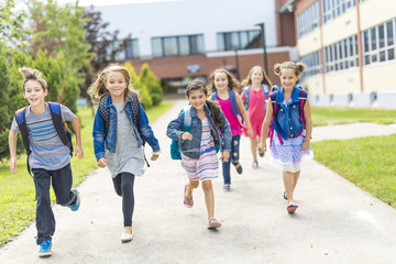 Great Portrait Of School Pupil Outside Classroom Carrying Bags