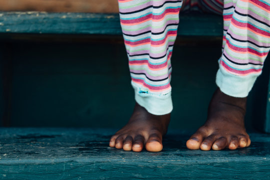 Black girl's feet in pijamas