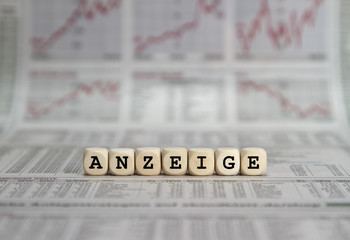 advertisement word built with letter cubes
