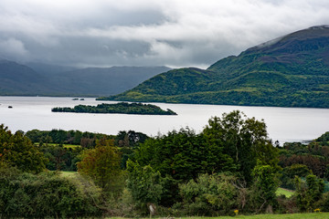 Fototapeta na wymiar Mountains, Fields and Lake on Cloudy Day in Killarney Ireland