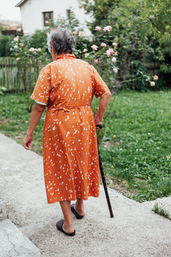 Senior woman with cane