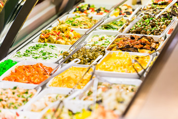 Display with Meze appetizers in delicatessen shop put on display