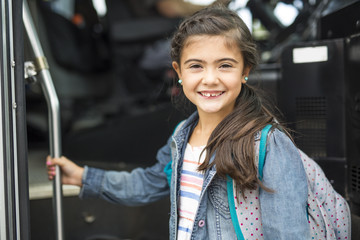 Great Portrait Of School Pupil Outside Classroom Carrying Bags