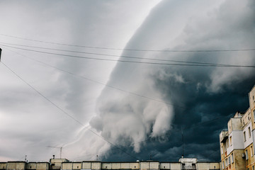 Beautiful storm sky with clouds over the city, apocalypse like