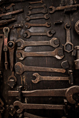 Fototapeta na wymiar Dirty set of hand tools on a wooden background.