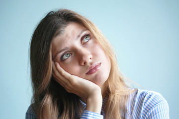 Young woman with head on a hand