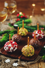 Variation of goat cheese balls appetizer with pistachio, pomegranate and flax seeds