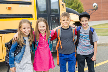 Great Portrait Of School Pupil Outside Classroom Carrying Bags