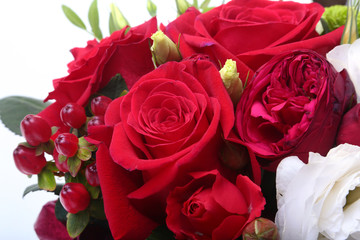 Luxury bouquet made of red and white roses on white background. Decoration for celebration.