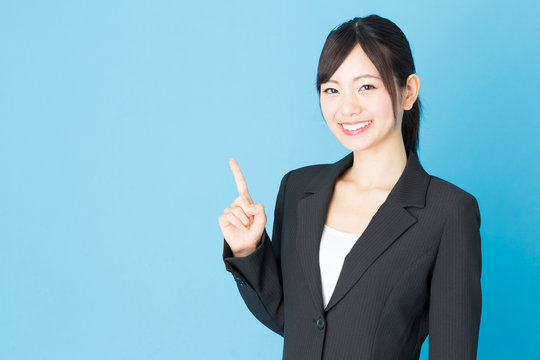 portrait of asian businesswoman isolated on blue background