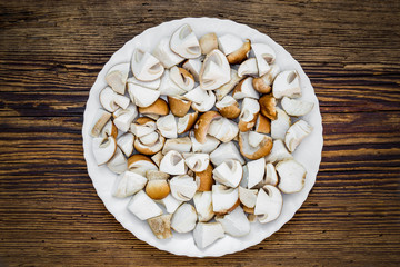 Sliced boletus mushrooms in white plate