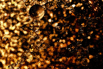 Abstract gold bokeh light. Golden sparkles isolated on black background. Christmas template for design.