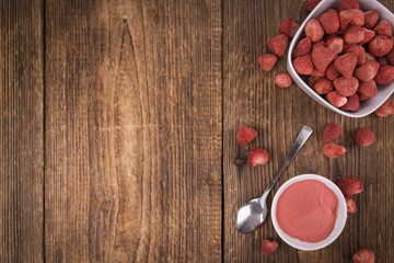 Fresh made Strawberry powder on a rustic background