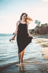Young stylish hipster woman having fun on the beach